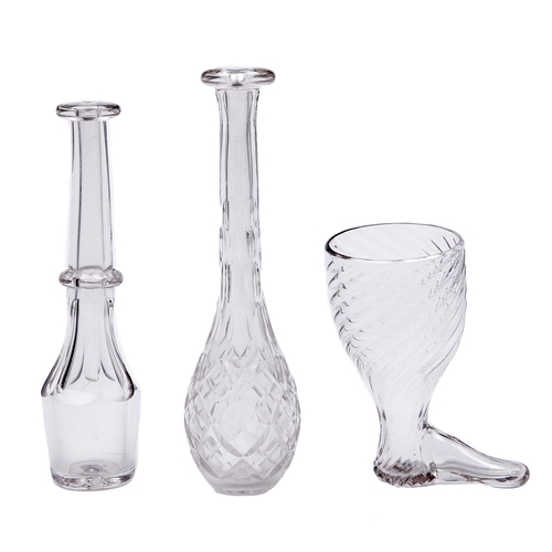 8 - An English wrythen fluted glass boot novelty stirrup cup and two contemporary flat or faceted glass ... 