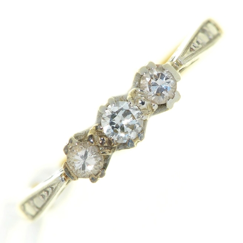 21 - A three stone diamond ring, gold hoop marked 18ct PLAT, 2g, size L½