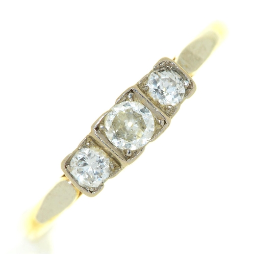 27 - A three stone diamond ring, gold hooped marked 18ct PLAT, 2.7g, size N
