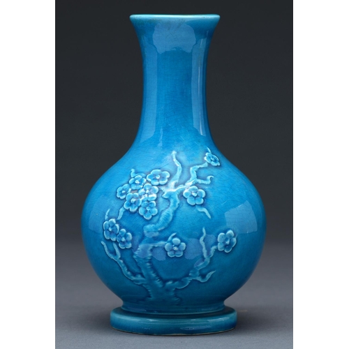 452 - A Chinese kingfisher blue monochrome glazed vase, decorated in relief with prunus, 21cm h... 