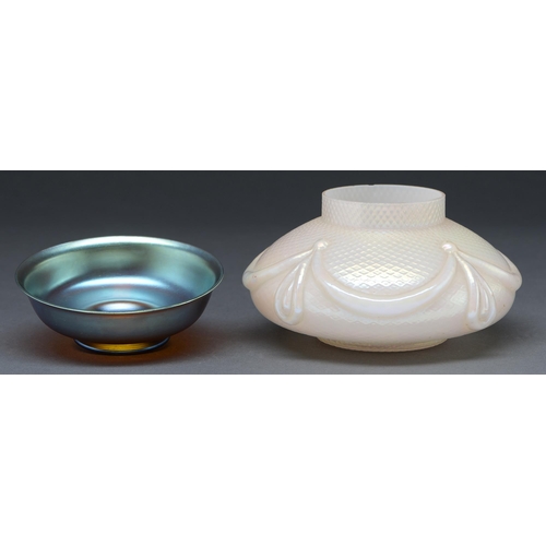 473 - An iridescent glass bowl and a cased iridescent glass moulded vase, both second quarter 20th c, bowl... 