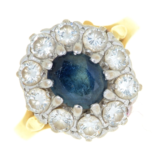 60 - A sapphire and diamond cluster ring, in 18ct gold, Convention marked, 5.5g, size N