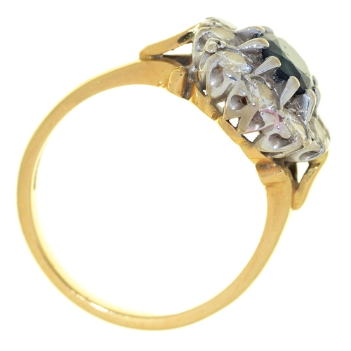 60 - A sapphire and diamond cluster ring, in 18ct gold, Convention marked, 5.5g, size N
