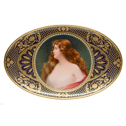502 - A Berlin oval dish, c1900,  finely painted by Wagner, signed, with a bust length portrait of a raven... 