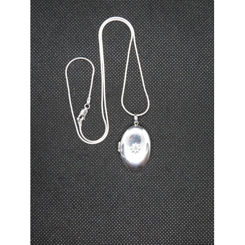 49 - Silver locket set with diamond on 18