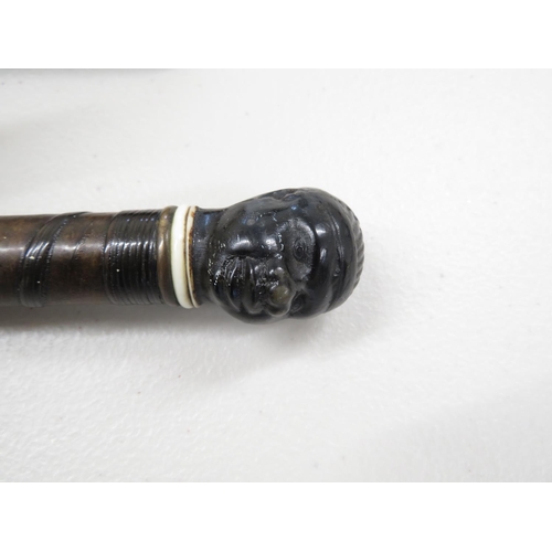 213 - Horn carved native stick handle with etched inner blade swordstick dating from approx. 1780 - 1820 w... 