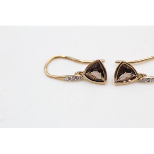 24 - 2 x 9ct gold gemstone earrings inc. diamond, smoky quartz, amethyst, peridot (2.4g)