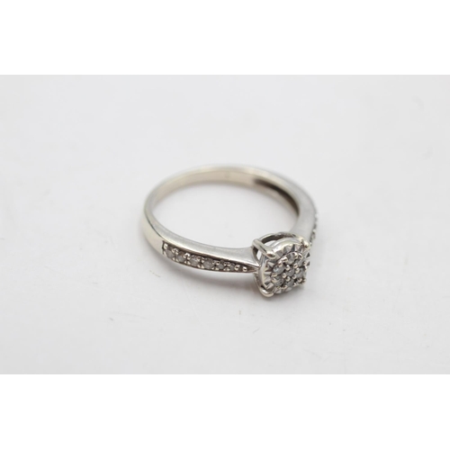 38 - 9ct white gold diamond cluster ring (2g)