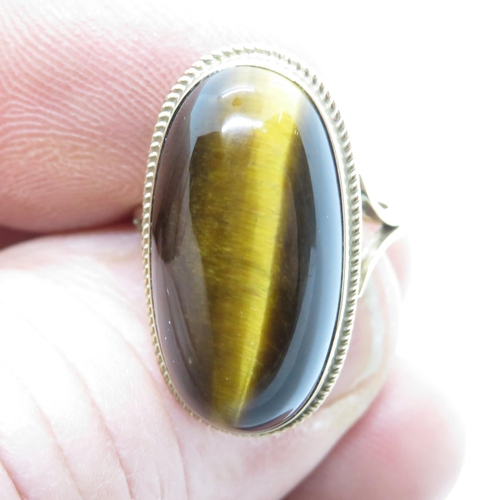 27 - 9ct gold Tiger's Eye cabochon stone ring size M 5.4g