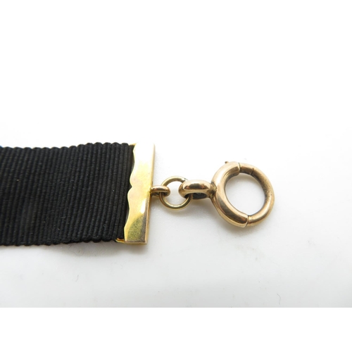 46 - Ladies 9ct gold and black cloth watch chain with clip and dog clip 8g total weight fully HM