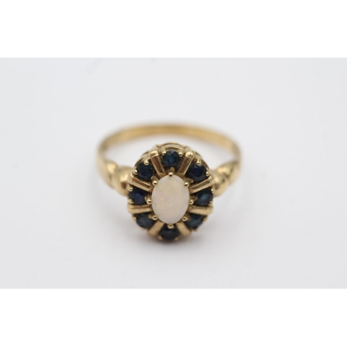 28 - 9ct gold opal framed sapphire halo ring (3.4g) size R