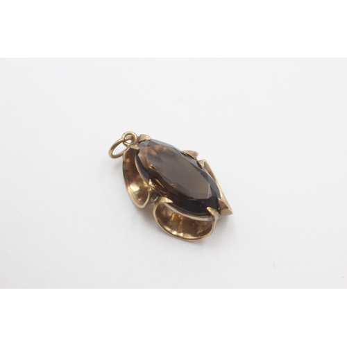 50 - 9ct gold smokey quartz stylised pendant (2.9g)