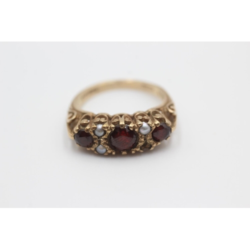 57 - 9ct gold garnet & seed pearl gypsy set ring, as seen (3.3g) Size M