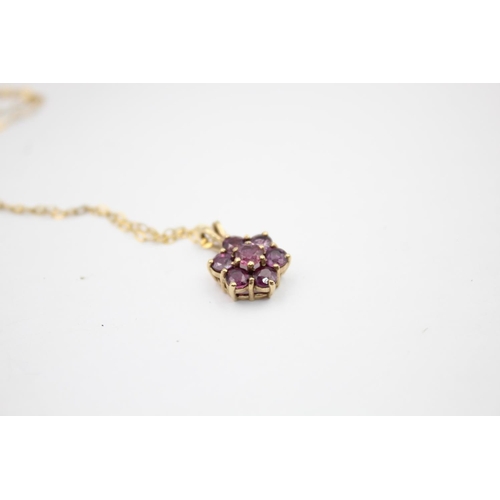 16 - 9ct gold ruby floral set pendant on chain (1.5g)
