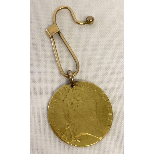 15 - A 22ct gold 1793 George III half guinea coin with 14ct gold bale on a 14ct gold button hook brooch. ... 