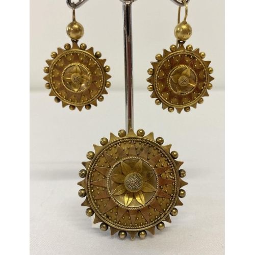 16 - A Victorian highly decorative gold mourning brooch and matching drop earrings.  Circular design with... 