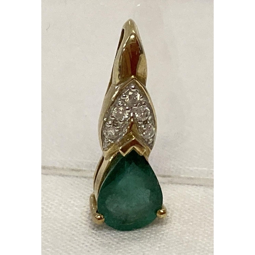 3 - A 9ct gold Transvaal emerald and diamond set pendant.  A teardrop cut emerald with 5 small round cut... 