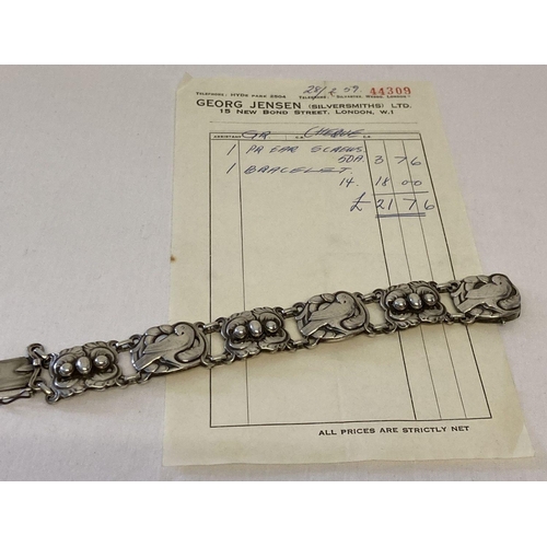 19 - A vintage Georg Jensen silver 6 link bracelet with dove & foliage motifs and 