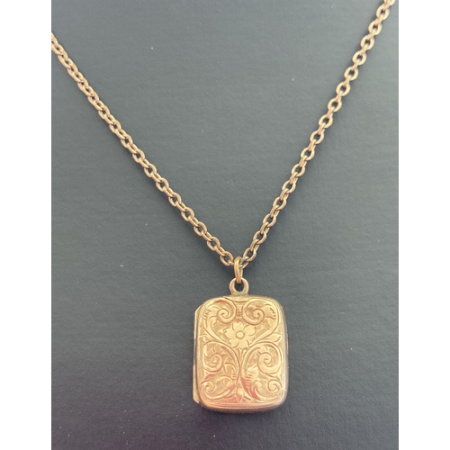 1002 - A vintage rose gold square shaped locket with floral engraving to front. On a gold plated belcher ch... 