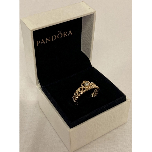 1013 - A boxed rose gold on silver tiara ring by Pandora. Set with a small round cut cubic zirconia stone. ... 