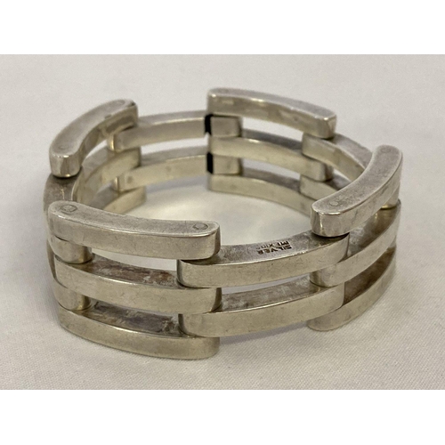 1024 - A Mexico Silver gate design bracelet with double hook fastening. Wear to one link. Marked 