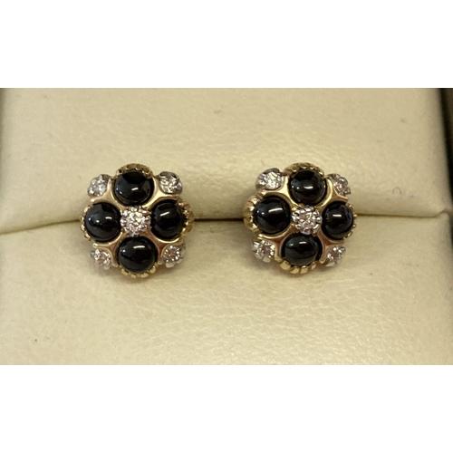 1026 - A pair of 9ct gold black onyx and diamond stud earrings by Luke Stockley, London. 4 small round cut ... 