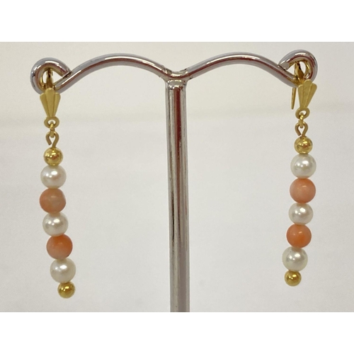 1031 - A pair of 9ct gold coral and pearl drop style earrings with Andralok backs. Each earring has alterna... 