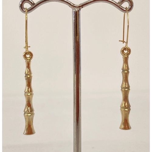 1053 - A pair of gold bamboo design drop style earrings. Test as 9ct. Each earring approx. 4.5cm long inclu... 