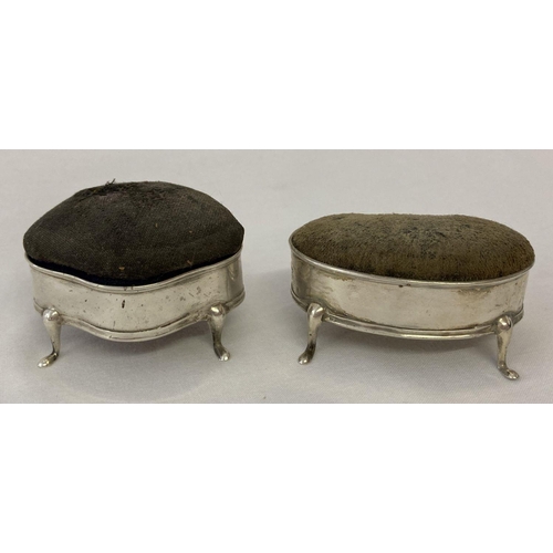 1112 - 2 Edwardian 3 footed silver pin cushions with blue fabric cushions (worn), both fully hallmarked. Wi... 