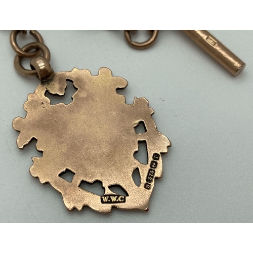 17 - A late 19th century 9ct gold albert watch chain with decorative monogrammed fob. T bar, lobster clas... 