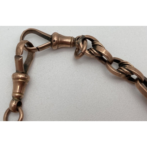 17 - A late 19th century 9ct gold albert watch chain with decorative monogrammed fob. T bar, lobster clas... 