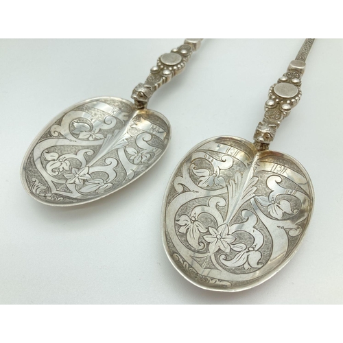 344 - A pair of Victorian Silver Mappin & Webb highly decorative serving spoons. Hallmarked to reverse of ... 