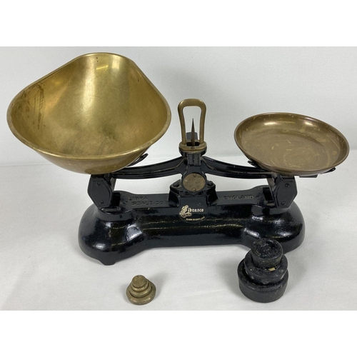 1016 - A vintage set of Libra Scale Co kitchen scales. Complete with brass bowls and weights.