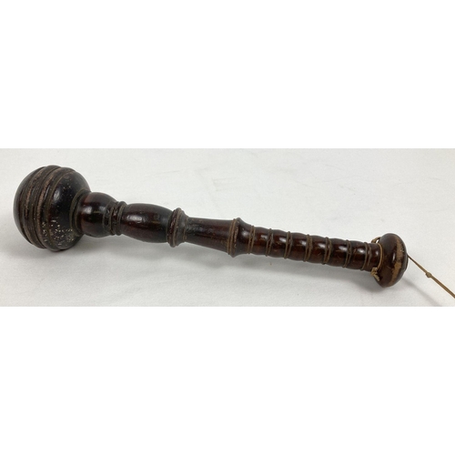 1334 - An early 20th century dark wood truncheon with bulbous head and turned detail. Approx. 33 cm long.