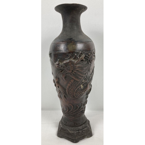 1118 - A Chinese bronze vase with dragon design and hexagonal shaped metal base. Impressed mark to undersid... 