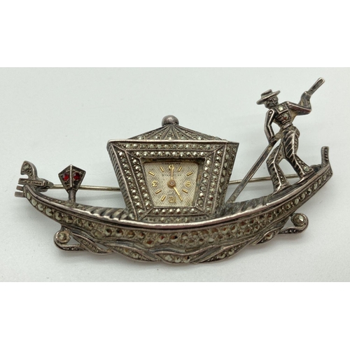 A vintage German silver Venetian Gondola brooch/watch. Set throughout with marcasite stones with two small garnets to the front lantern. Back marked " 925 N Sterling Germany". Approx. 3.5 x 7cm.