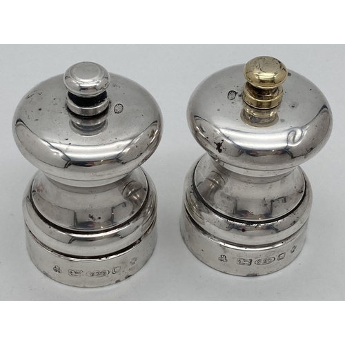 1035 - A pair of 925 silver Peter Piper salt & pepper mills. Each fully hallmarked for London 2000, with M ... 