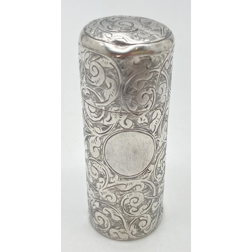 1037 - A Victorian silver hinge lidded canister with ornate scroll and foliate engraved decoration. Circula... 