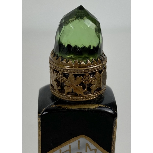 1265 - A vintage 1920's brass painted Shimy perfume bottle with Egyptian decoration and pierced vine work b... 