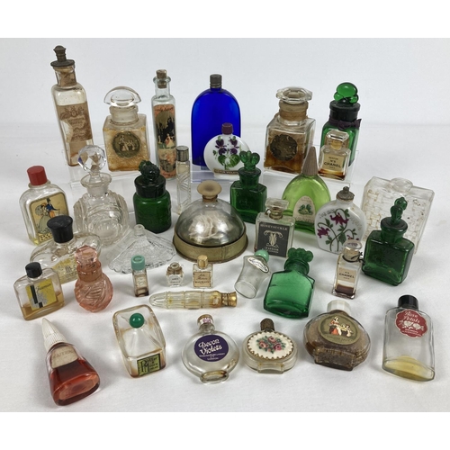 1266 - A collection of vintage glass perfume bottles in varying sizes and designs. Some with contents. To i... 