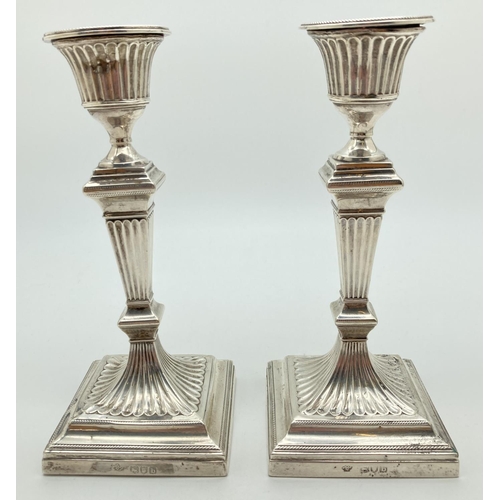 1182 - A pair of William Hutton & Sons, Victorian Silver candlesticks of classical form. Both hallmarked to... 