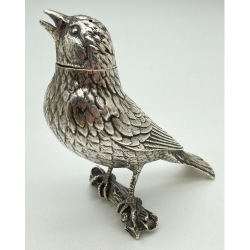 1187 - A late 19th Century German Silver large novelty pepper in the form of a songbird on a branch. With m... 