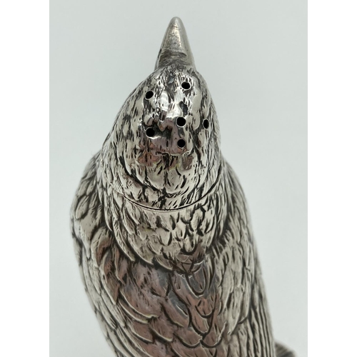 1187 - A late 19th Century German Silver large novelty pepper in the form of a songbird on a branch. With m... 