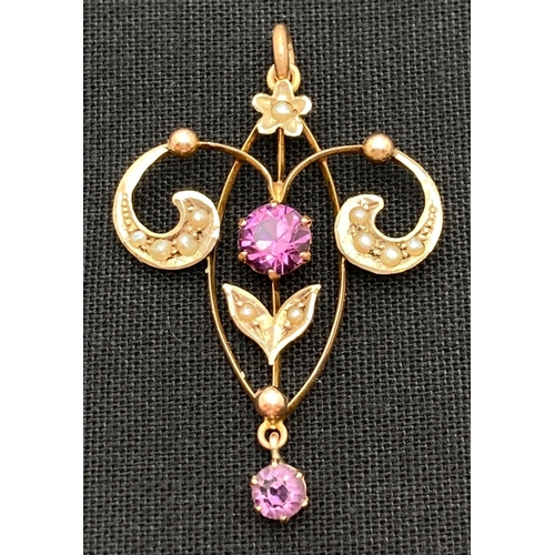 1017 - An Art Nouveau 9ct gold pendant set with seed pearls, central purple coloured stone and drop pendant... 