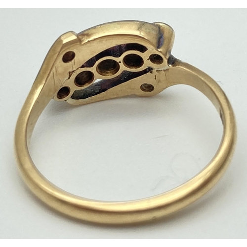1001 - An Edwardian 18ct gold, platinum set diamond ring with 5 central round cut stones. In an open twist ... 