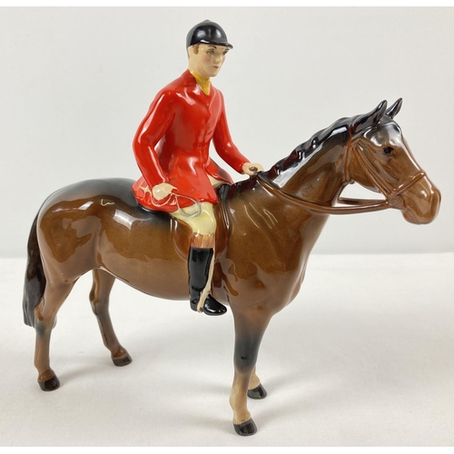 A Beswick ceramic Huntsman and horse figurine #1501, in brown gloss. Issued from 1957 - 95 and modelled by Arthur Gredington. With black Beswick crest backstamp. No chips, cracks or signs of repair.