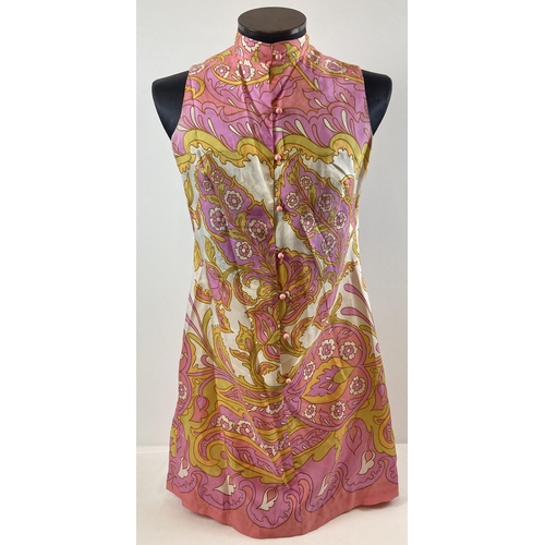 A vintage 1960's bold floral print pure silk sleeveless shift dress by Dollyrockers Designed By Sambo. Pink, yellow and cream colourway with mandarin collar and pale pink ball buttons to front. Approx 34 inch chest.