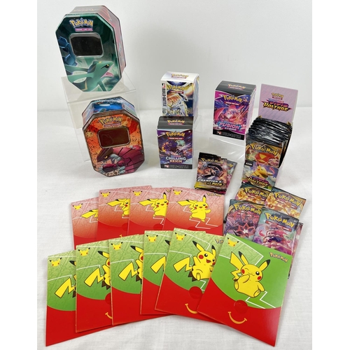21 - A collection of Pokemon card empty packets, tins, boxes and envelopes. To include: 10 x Macdonalds 2... 