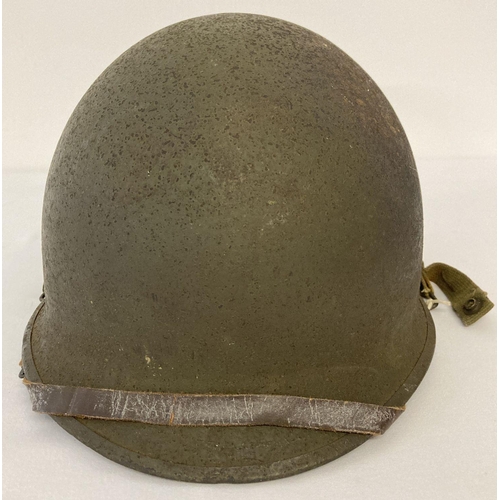 110 - Original US M1C WW2 Paratrooper helmet - 1944 specification, rear join. Complete with helmet chinstr... 