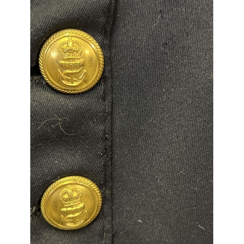 109 - An early 20th century Royal Navy dress coat with bullion thread detail and brass buttons. Buttons to... 